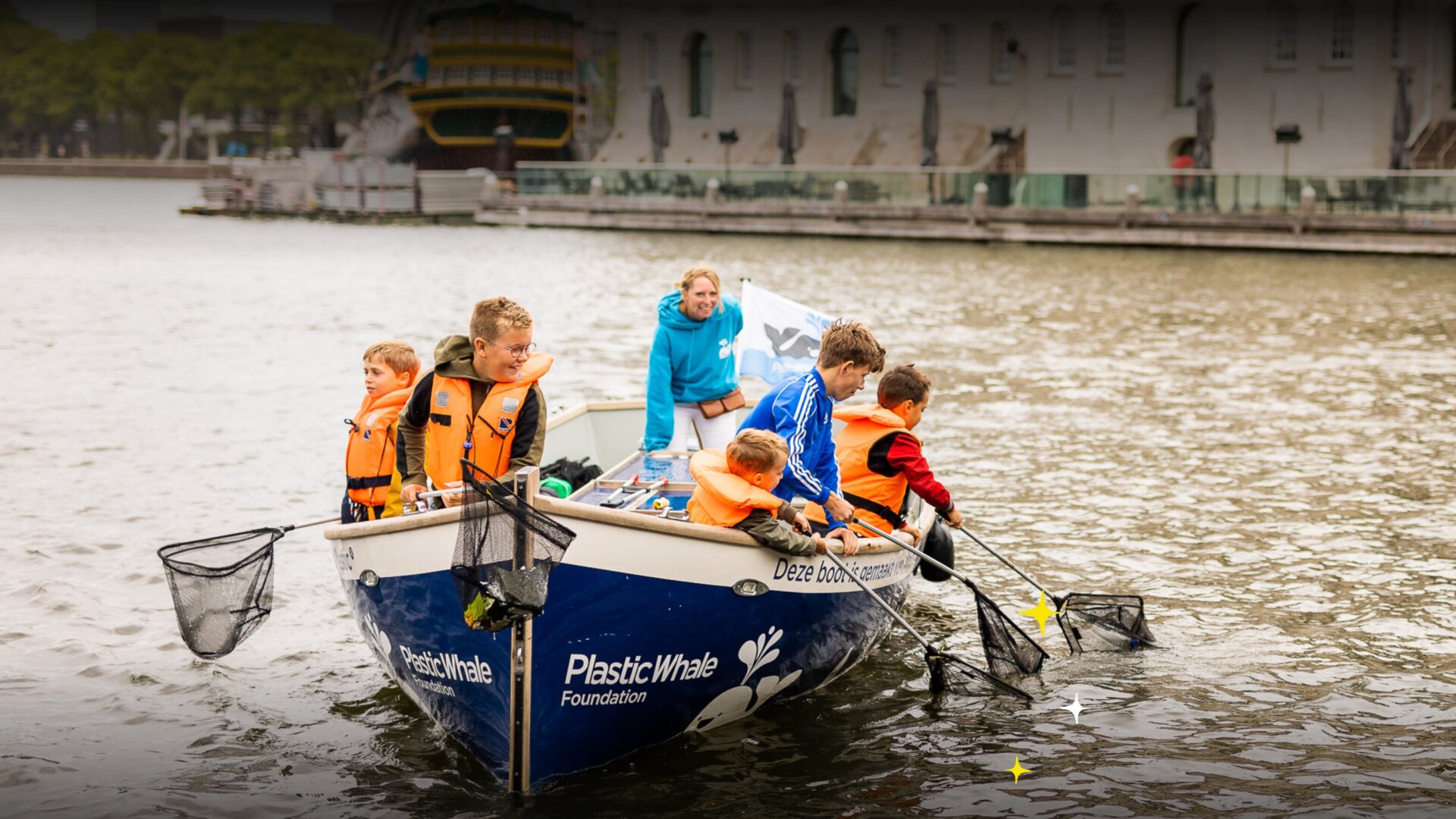 Plastic fishing with kids on a Plastic Whale Foundation boat.